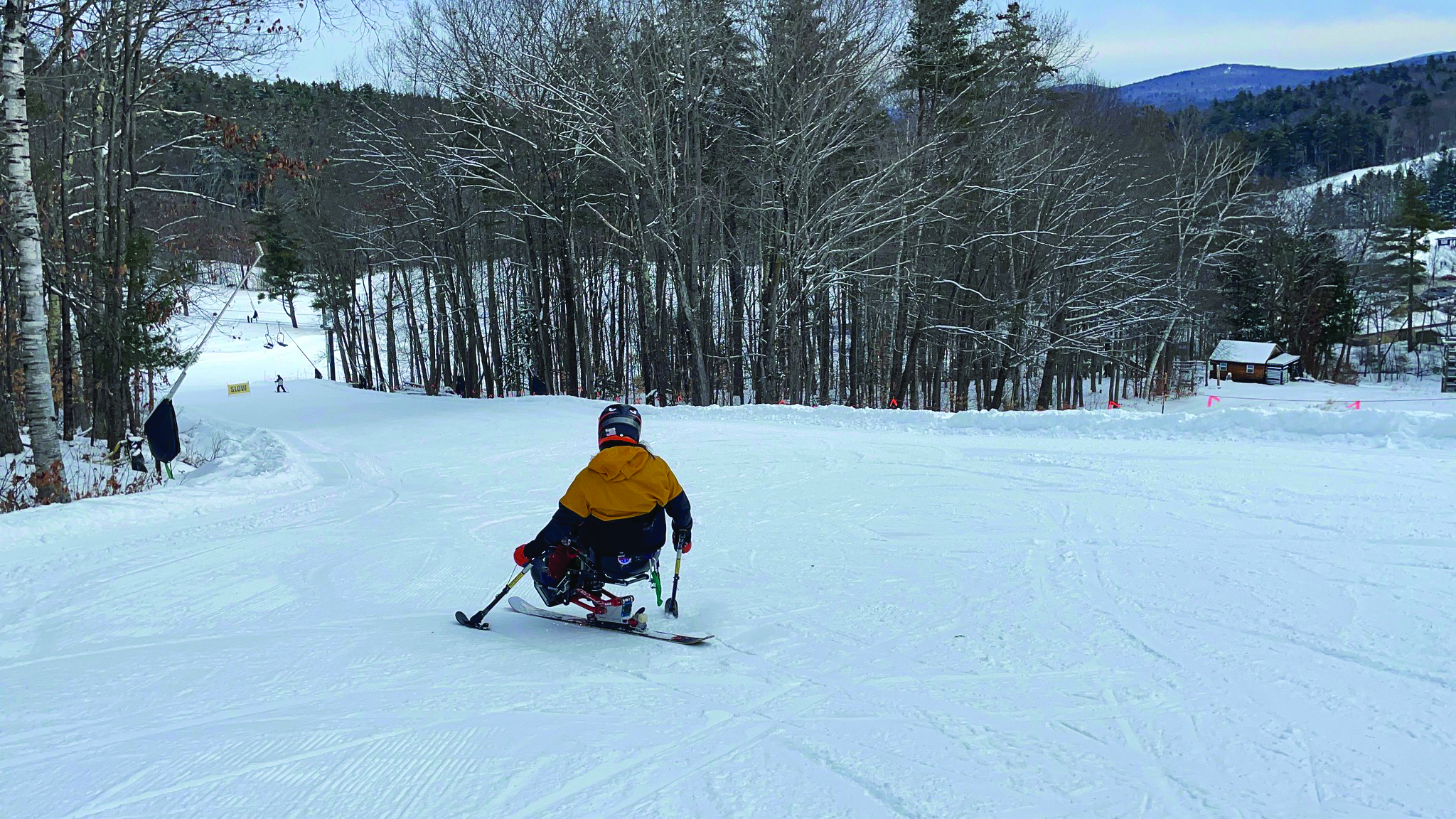Mono skier skiing at the winter sports clini